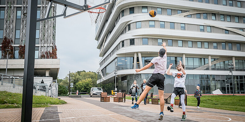 Students playing basketball
