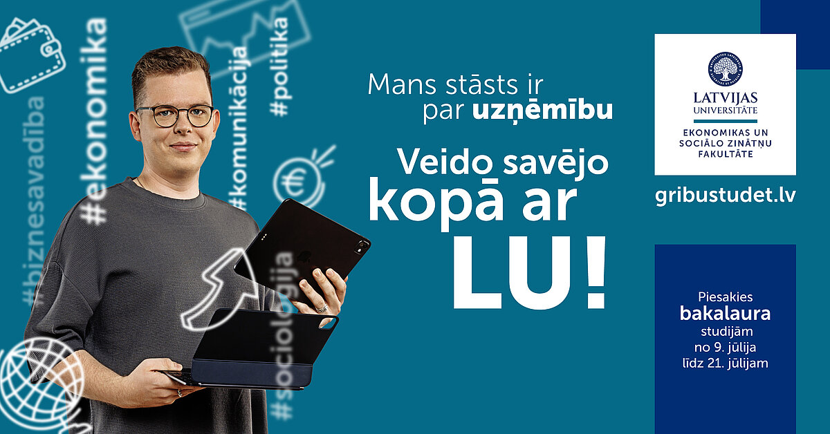Jauns puisis ar brillēm, rokās dators un planšete